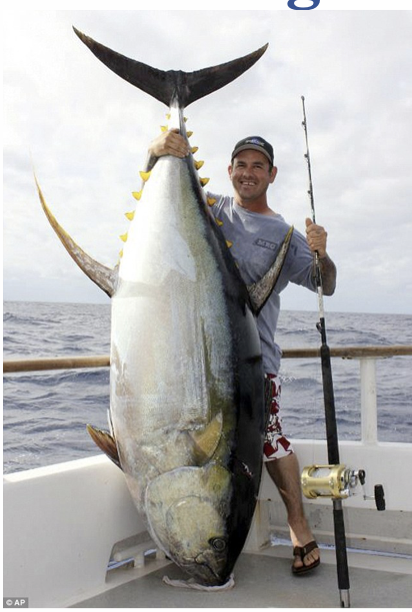 Man holding large fish that he caught